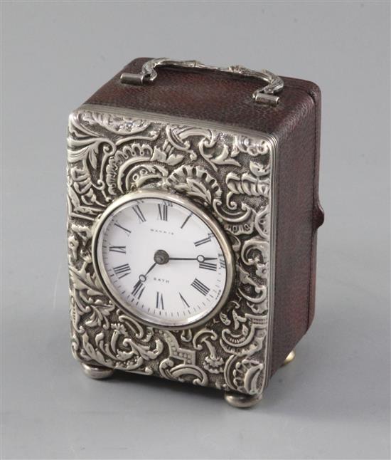 A late Victorian repousse silver mounted carriage timepiece, retailed by Harris, Bath, 93mm.